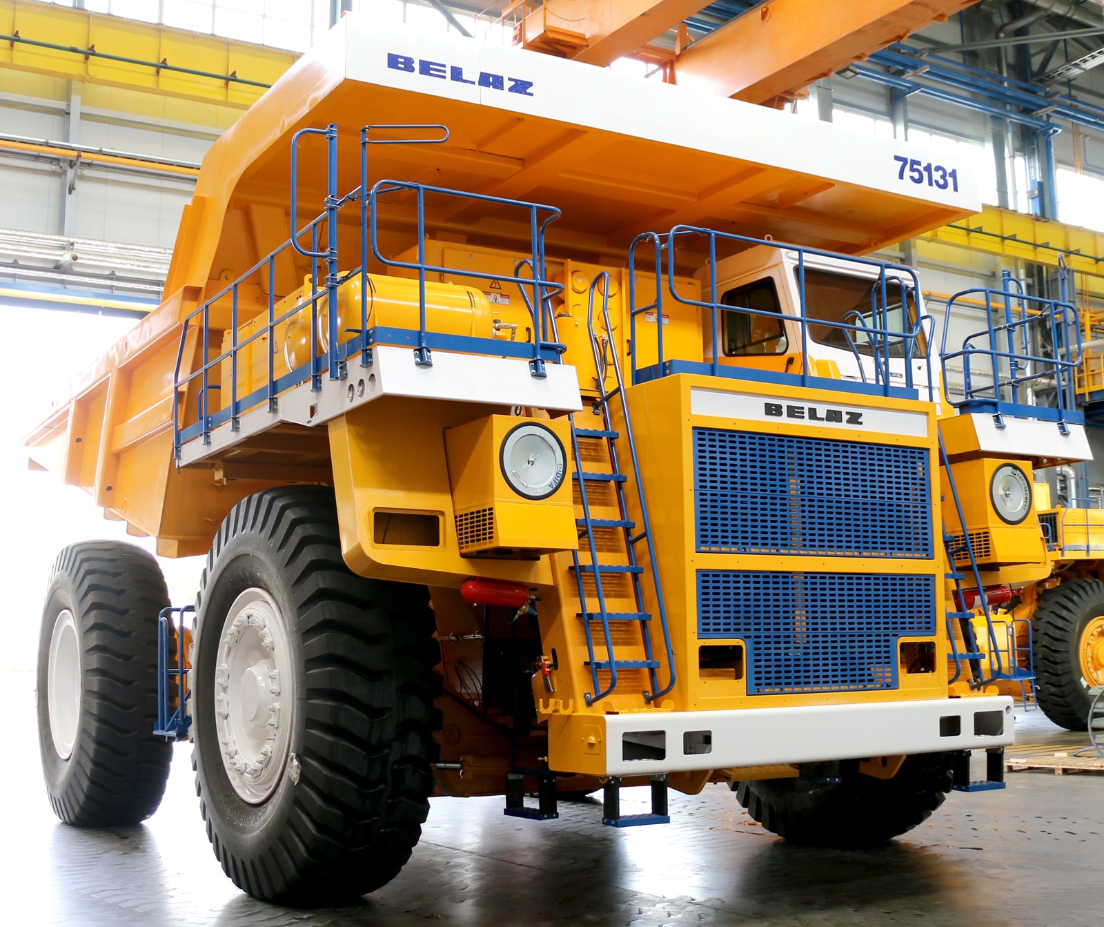 BELAZ 75131 dump truck undergoes engine replacement with KTA50-C1600 for enhanced performance.